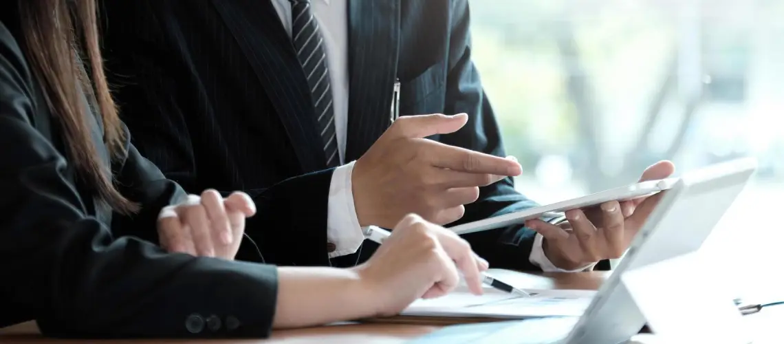 Professional conducting a business valuation in an office setting
